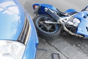 Car knocked over motorcycle